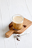 Bulletproof coffee made with coffee, coconut oil, soy milk and butter