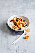 Date porridge with fruit and walnuts