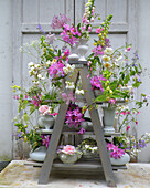 Flower decoration with foxglove (Digitalis lutea) on a tiered stand