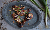 Glazed chicken thighs with peanuts and green onions (Thailand)