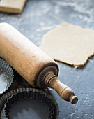 Rolling pin, baking tins and rolled out dough