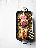 Rack of lamb with new potatoes, onions, and thyme