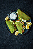 Filled Green Pancakes, wrapped and served with salad