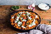 Red lentil dahl topped with yogurt