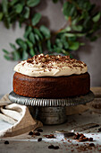A coffee cake topped with whipped cream infused with Irish Cream liqueur. Grated chocolate provides the final garnish.