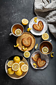 Lemon Palmiers, made from puff pastry on a dark background