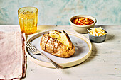 baked potato served with beans and cheese