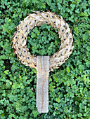 Autumn wreath of dried physalis, ground cherry in the flowerbed