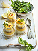 Lemon layered dessert with fresh herbs