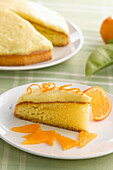 A slice of mandarin sponge cake on a plate