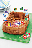 Stadium cake decorated with paper flags