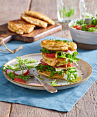Cottage cheese pancakes with tomatoes, radishes and lettuce