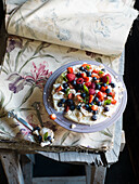A white chocolate dessert with fresh summer berries