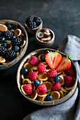 Breakfast bowls with mini pancake cereal and berries