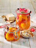 Preserved muscatel peaches with red pepper and rose petals