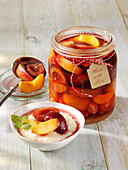 Rum stew with apricots, peaches, plums and strawberries