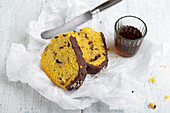 Two pieces of vegan Bundt cake with saffron, dark and white rice-milk chocolate