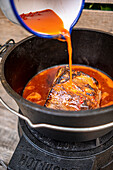 Cochinita pibil (Mexican dish with slow roasted pork) being made
