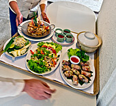 Various Thai dishes on a tray (room service)
