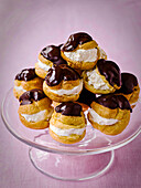 Profiteroles with cream and chocolate icing
