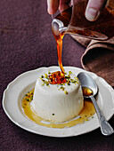 Italian panacotta with pistachios and drizzle of honey
