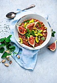 Chocolate rice pudding with figs and kiwi