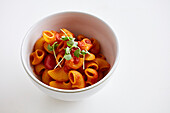 Pasta with tomato sauce in a small bowl