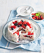 Frozen cake with currant berries and meringues