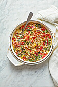 Creamed chard with bacon and pine nut crumbs