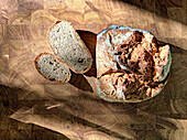 Walnut bread, cut on a wooden base