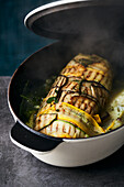 Braised courgette-and-aubergine roulade with a lentil-and-rice filling