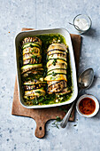 Braised courgette-aubergine roulades with lentil-rice filling