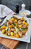 Lime chicken with courgettes and potatoes tray bake served with mayonnaise