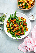 Green beans with fried bacon and chanterelles
