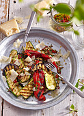 Grilled vegetables with spicy dressing and parmesan cheese