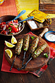 Spicy lamb koftas with mint served with tomato salad