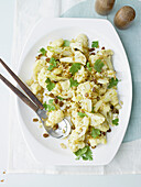 Cauliflower salad with pine nuts and golden raisins