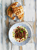 Whipped hummus with lamb and pomegranate seeds