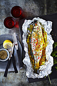 Sea bass with fennel, lemon and spices cooked in foil packet