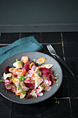 Root vegetable salad with lime vinaigrette and smoked trout