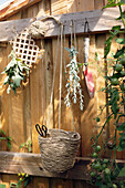Wooden wall for hanging tools and drying herbs