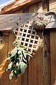 Wooden wall for hanging tools and drying herbs