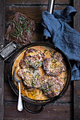Pork chops with cream sauce and rosemary