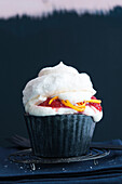 Meringue cupcake with strawberries and cream