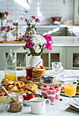 Set table for brunch buffet in country kitchen