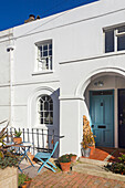 White painted facade and front patio