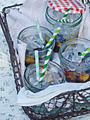 Fruit cocktail in jars with ice