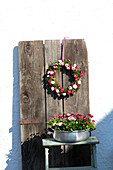 Wreath and Easter nest made out of bellis in metal pot
