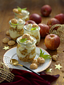 Baked apple tiramisu with macaroons served in a glass (Christmas)