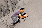 Palaeontologist working with fossilized bone fragments